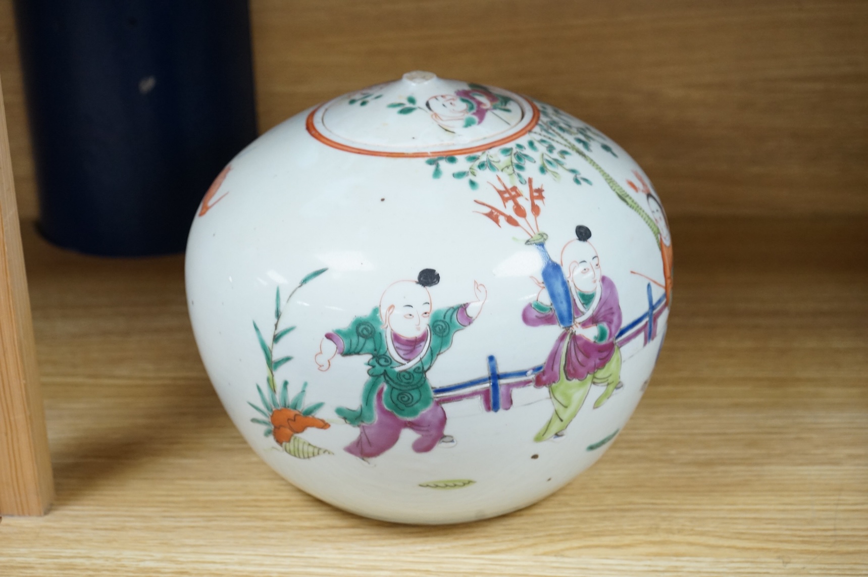 A 19th century Chinese famille rose 'Boys' jar and cover, 19cm